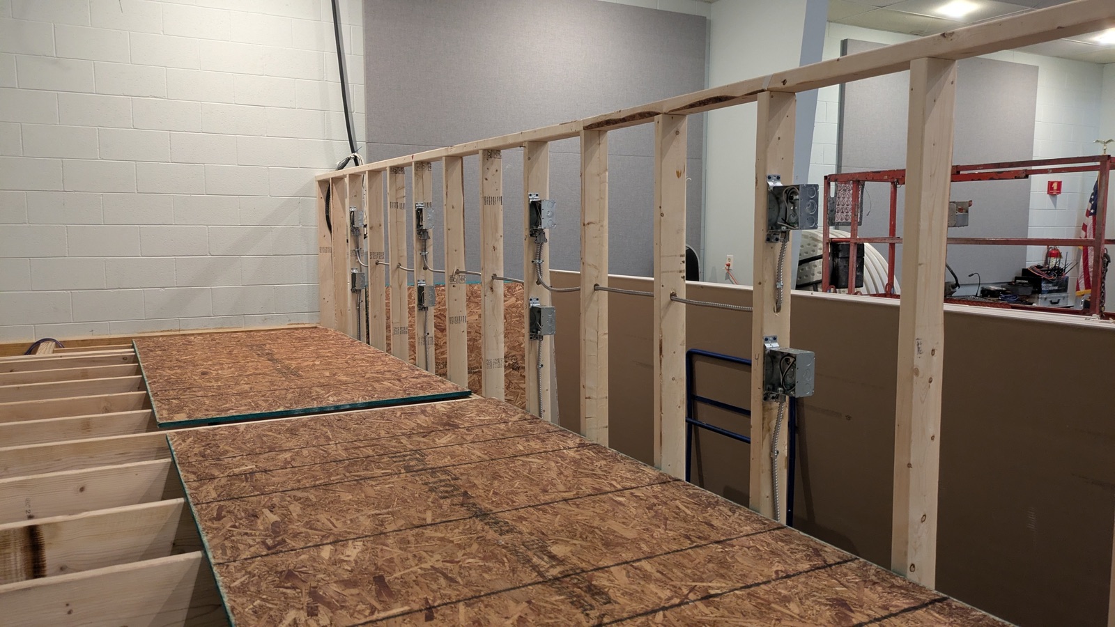 Device boxes mounted on studs with circuits pulled before drywall