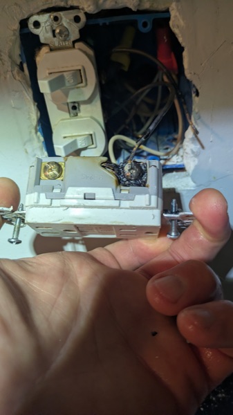 Failed switch and outlet device removed from a wall box