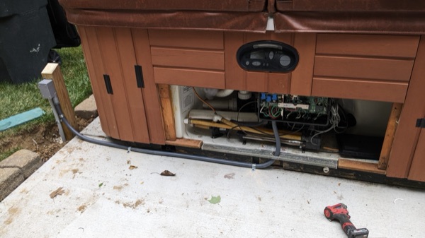 Hot tub with a new electrical disconnect and bonded equipment pad