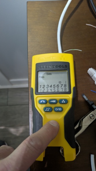 Klein Tools network cable tester showing a passing wiring result