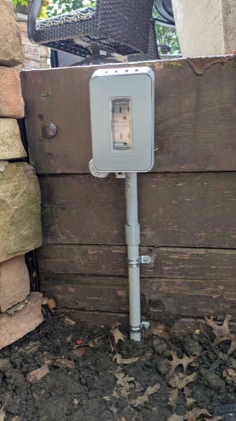 Weatherproof outdoor GFCI outlet mounted on a conduit riser