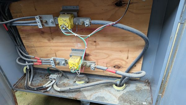 Heavy service feeders and a fused disconnect terminated inside an outdoor enclosure