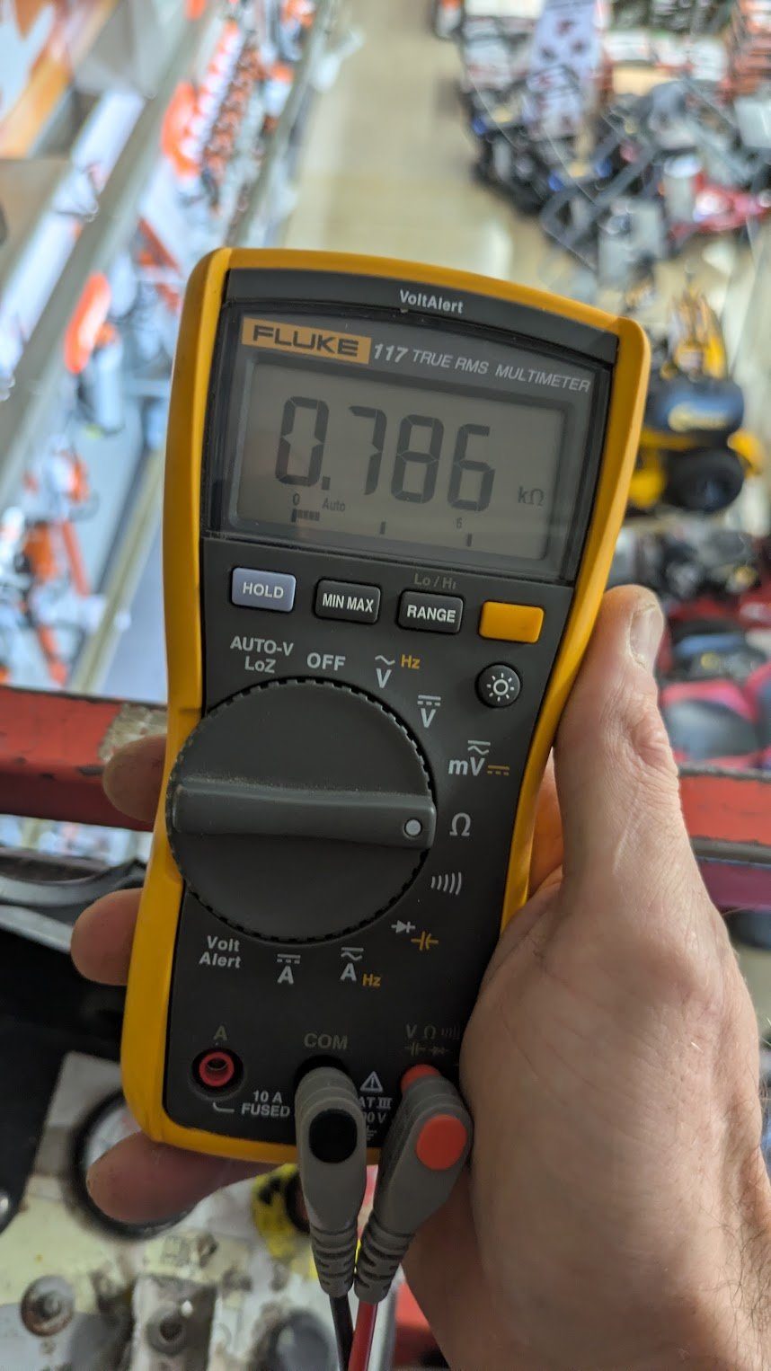 Benrishi Electrical testing a circuit with a Fluke 117 multimeter